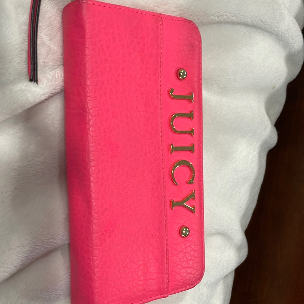 Used juicy pink wallet. Shows a little wear no rips few marks
